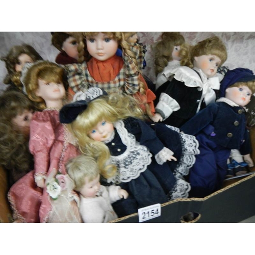 2154 - A good lot of 20th century porcelain headed dolls.