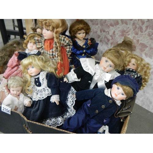 2154 - A good lot of 20th century porcelain headed dolls.