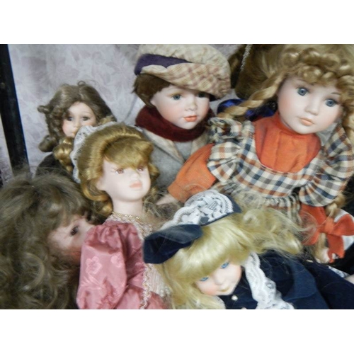 2154 - A good lot of 20th century porcelain headed dolls.