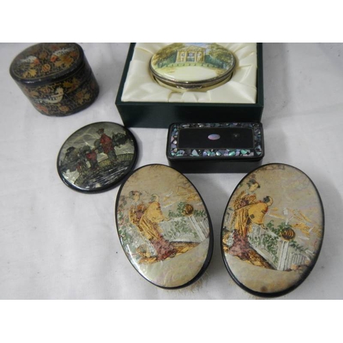 2165 - A mixed lot including papier mache' and mother of pearl snuff box.