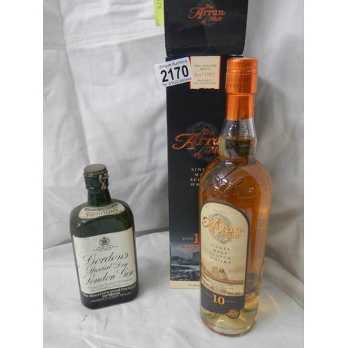 2170 - An unopened bottle of Arran malt whisky and an opened bottle of Gordon's gin.