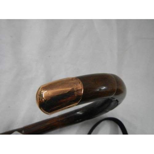 2172 - A walking stick with 9ct gold mount.