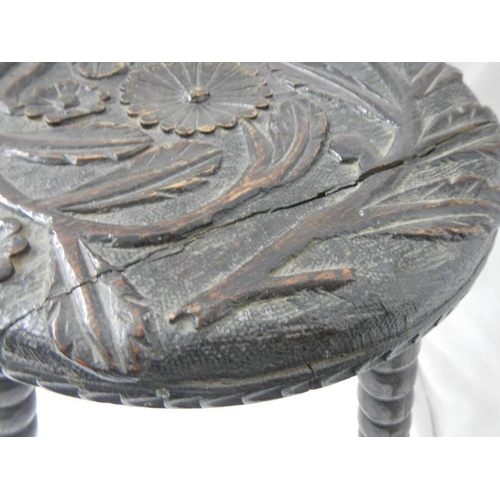 2177 - A carved stool on bobbin style legs.