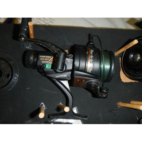 2199 - A fishing reel and floats carry case with contents.