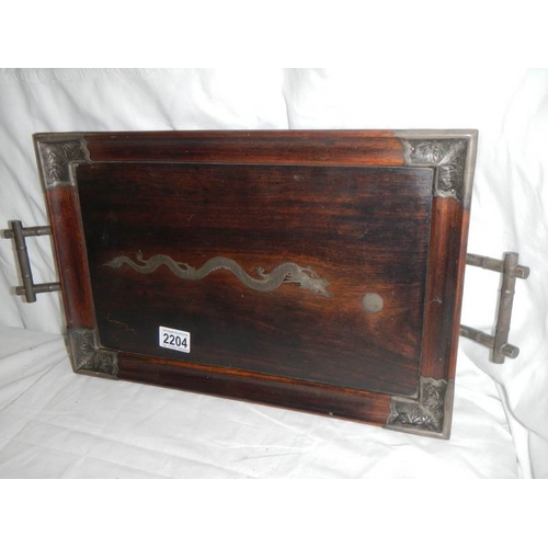 2204 - A Chinese rosewood tray with silver embellishments including dragon in centre.