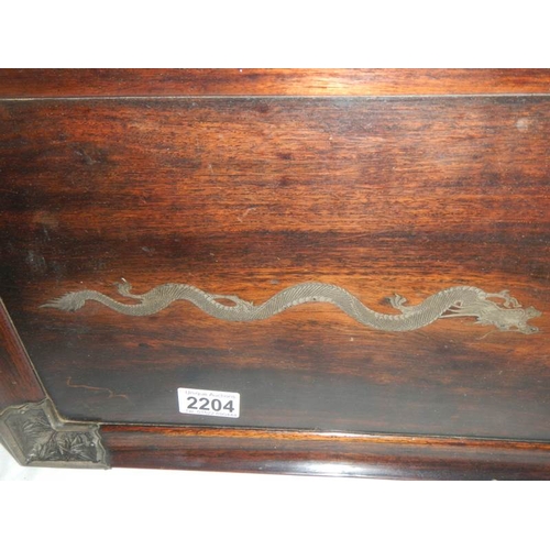 2204 - A Chinese rosewood tray with silver embellishments including dragon in centre.