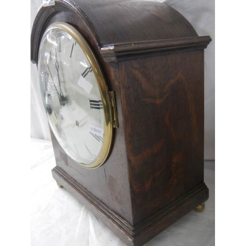 2212 - A 'Whitaker, Oldham' bracket clock with silvered dial.