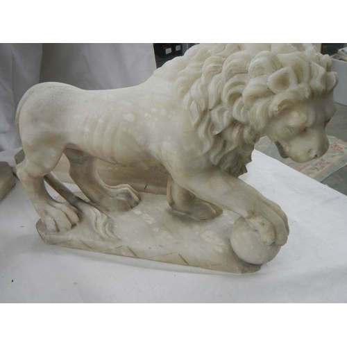 2215 - A matching pair of Victorian alabaster lions on bases.