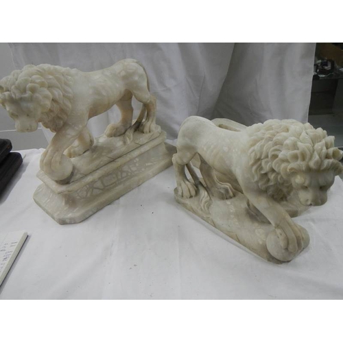 2215 - A matching pair of Victorian alabaster lions on bases.