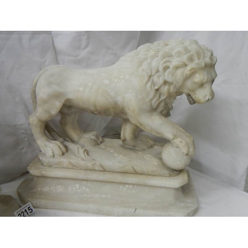 2215 - A matching pair of Victorian alabaster lions on bases.