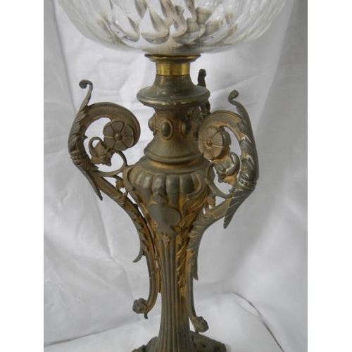 2217 - A Victorian brass oil lamp with cut glass font.