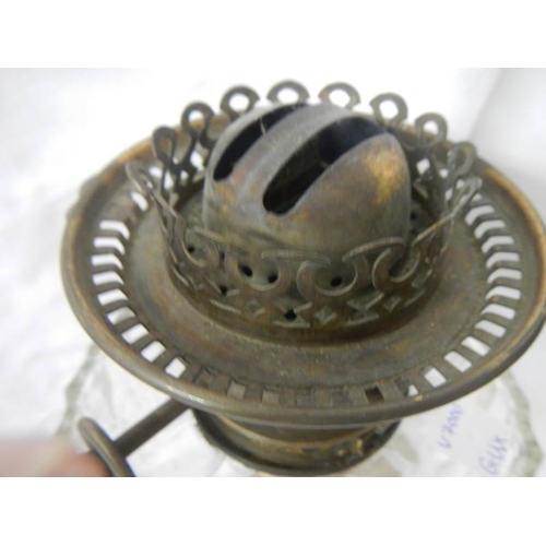 2217 - A Victorian brass oil lamp with cut glass font.