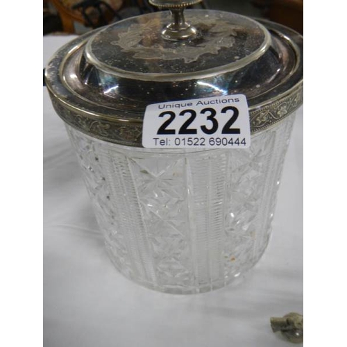 2232 - A cut glass biscuit barrel, a toast rack and  a silver plate cigarette box.