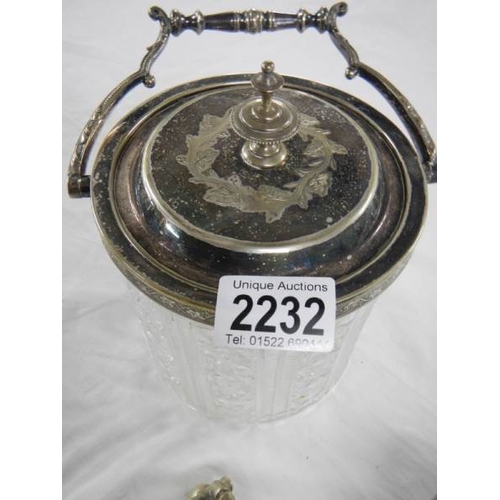 2232 - A cut glass biscuit barrel, a toast rack and  a silver plate cigarette box.