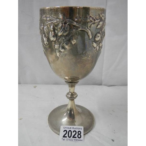 2028 - A good hall marked silver embossed chalice, 240 grams.