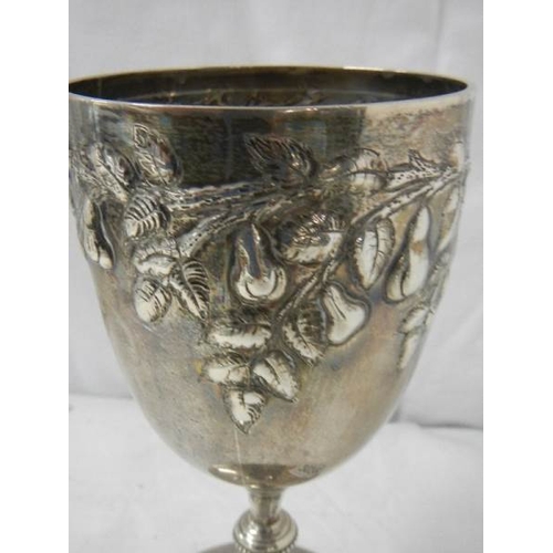 2028 - A good hall marked silver embossed chalice, 240 grams.