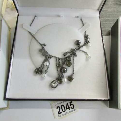 2045 - 2 dazzling vintage necklace and a further necklace in a designer style.