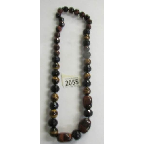 2055 - A long necklace of gemstone beads (Tigers eye).