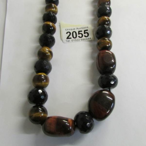 2055 - A long necklace of gemstone beads (Tigers eye).