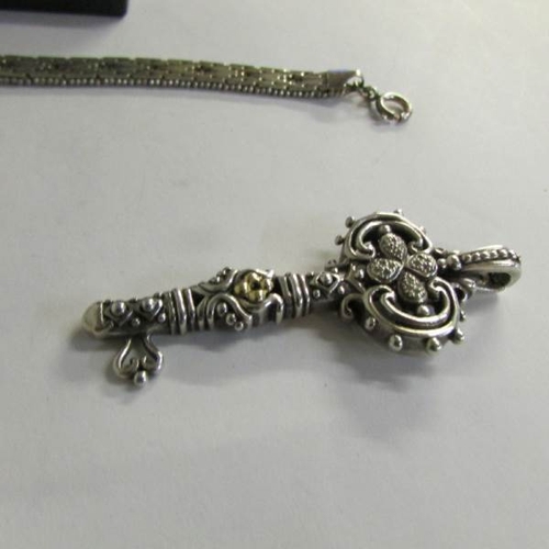 2068 - A collection of silver items: Italian bracelet, 2 crosses, brooch and St. Christopher.