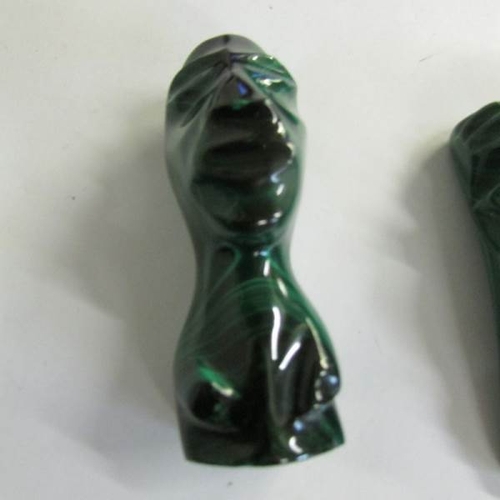 2071 - 2 malachite stone paperweights as heads.