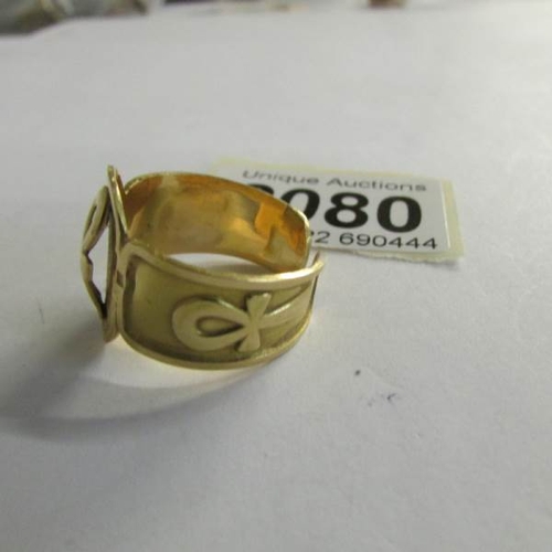 2080 - An Egyptian gold ring with Ankh symbol, tests as 18ct, size Y.  11 grams