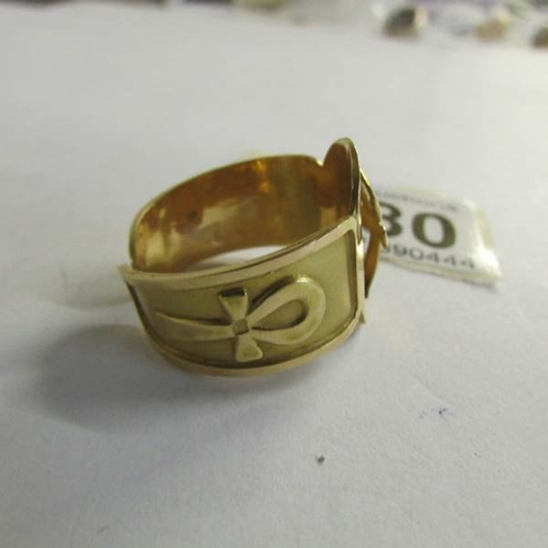 2080 - An Egyptian gold ring with Ankh symbol, tests as 18ct, size Y.  11 grams