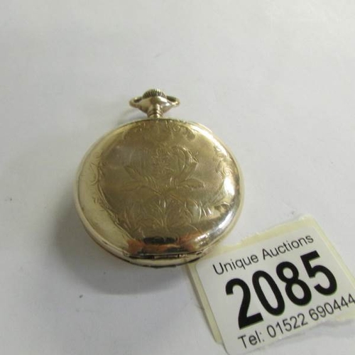 2085 - An Elgin pocket watch in gold plate, hinge needs repair.