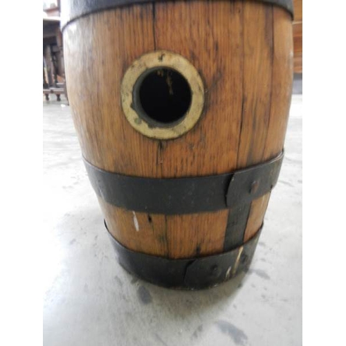 2266 - An old ship's whisky barrel with metal bands, 17'' tall.