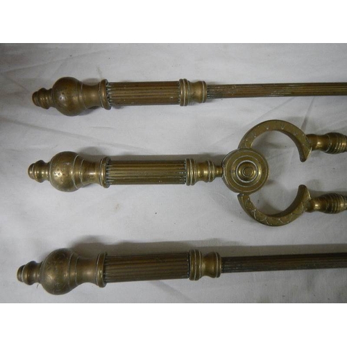 2267 - A set of Victorian reeded brass fire irons, 25'' long.