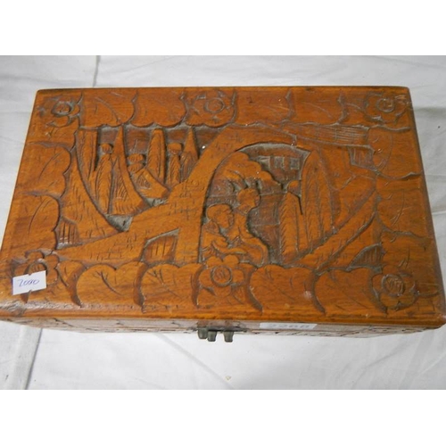 2268 - A carved camphor wood box, 12'' wide, catch broken.