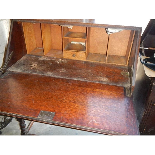 2270 - An oak drop front bureau.