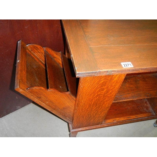 2271 - A fold over card table with pull down side and open door.