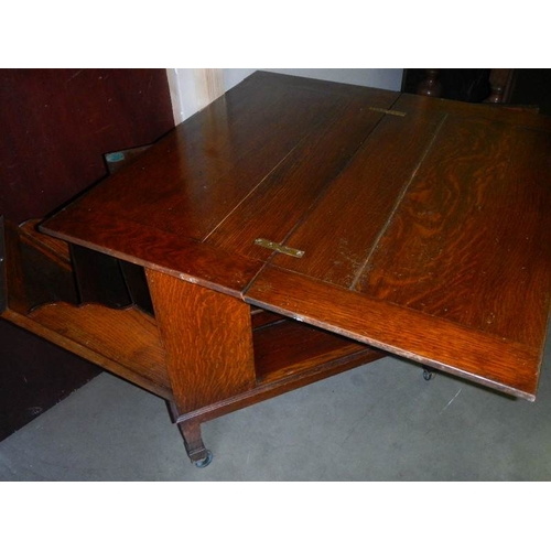 2271 - A fold over card table with pull down side and open door.