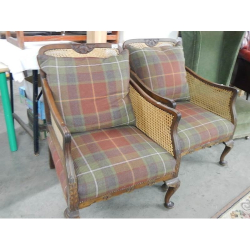 2295 - A pair of Bergere arm chairs.