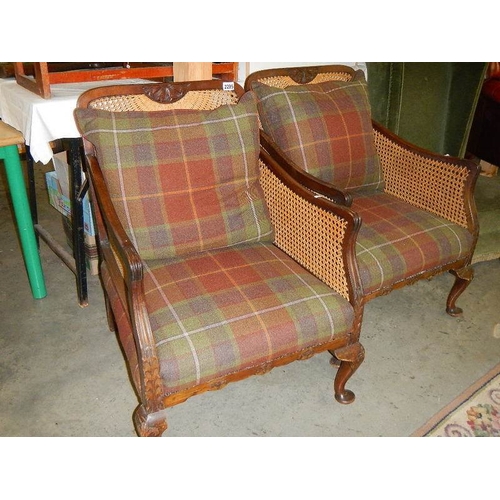 2295 - A pair of Bergere arm chairs.