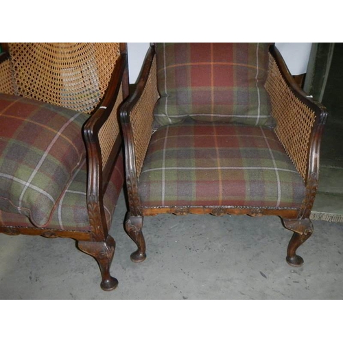 2295 - A pair of Bergere arm chairs.