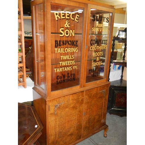 2299 - An Edwardian walnut veneered advertising display cabinet.