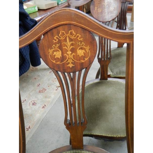 2301 - A set of 4 mahogany inlaid chairs.