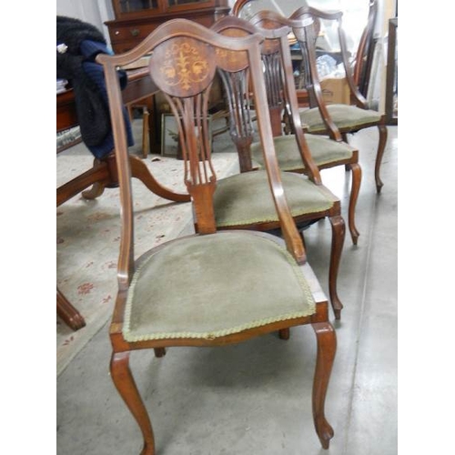 2301 - A set of 4 mahogany inlaid chairs.