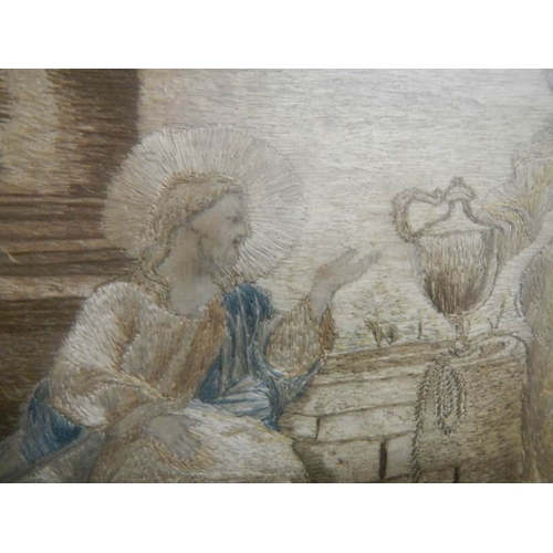 2302 - A gilt framed Italian antique embroidery depicting Jesus Christ at a well with a woman.  Hand writte... 