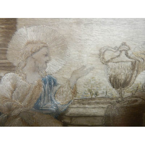 2302 - A gilt framed Italian antique embroidery depicting Jesus Christ at a well with a woman.  Hand writte... 