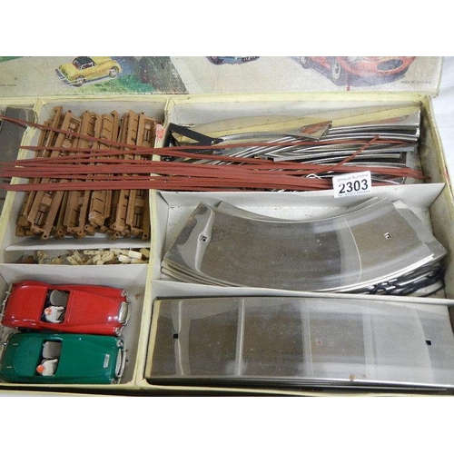 2303 - A 1960's V.I.P Victory Industries electric model roadways set with Austin Healey and MGA cars and in... 