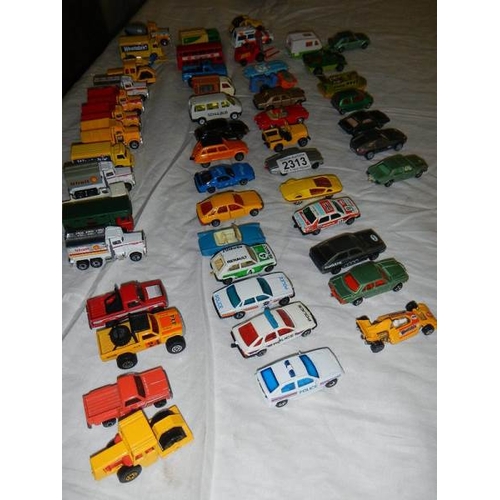 2313 - Approximately 50 die cast cars, trucks etc.,