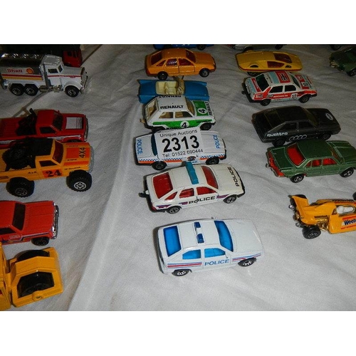 2313 - Approximately 50 die cast cars, trucks etc.,