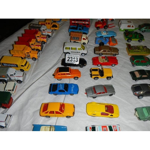 2313 - Approximately 50 die cast cars, trucks etc.,