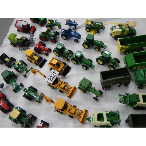 2327 - In excess of 40 die cast farm vehicles etc.,