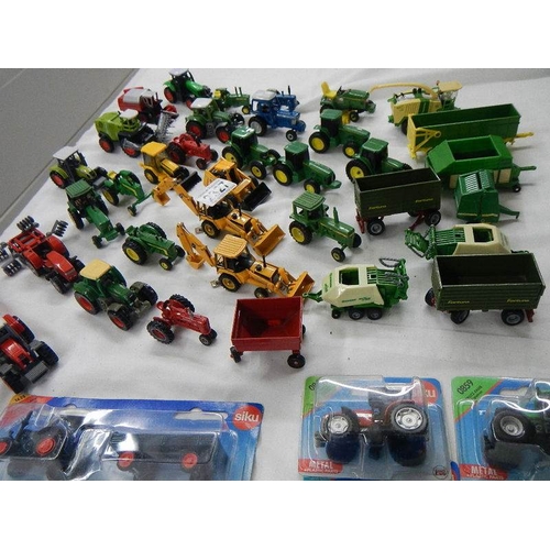 2327 - In excess of 40 die cast farm vehicles etc.,