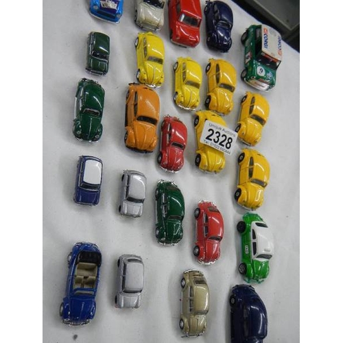 2328 - approximately 24 die cast cars including Volkswagen Beetles and Mini's etc.,