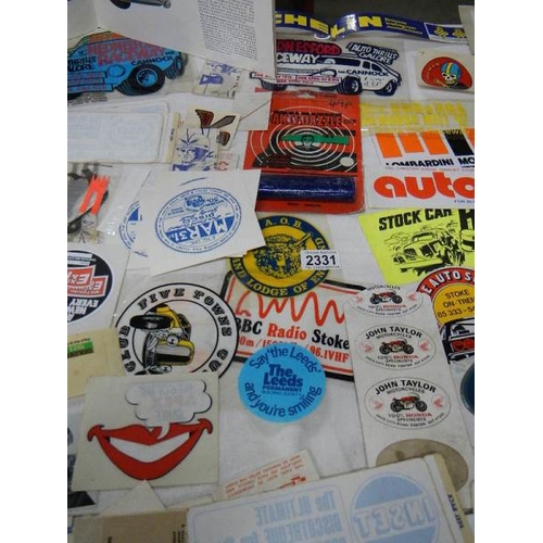 2331 - A large quantity of car stickers etc.,